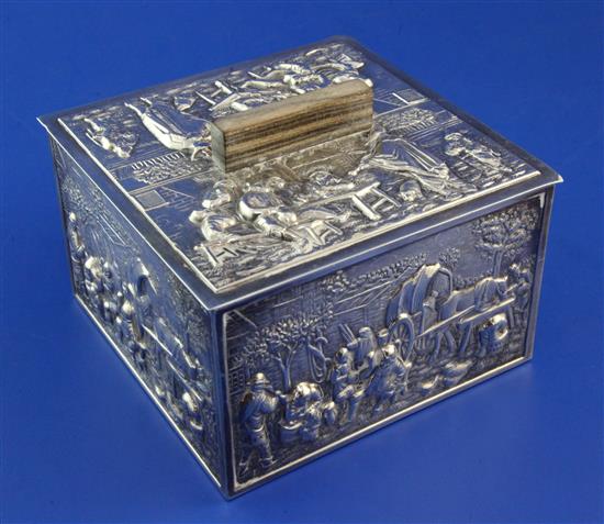 A 20th century Dutch? repousse silver mounted wooden cigarette box and cover, 4.5in.